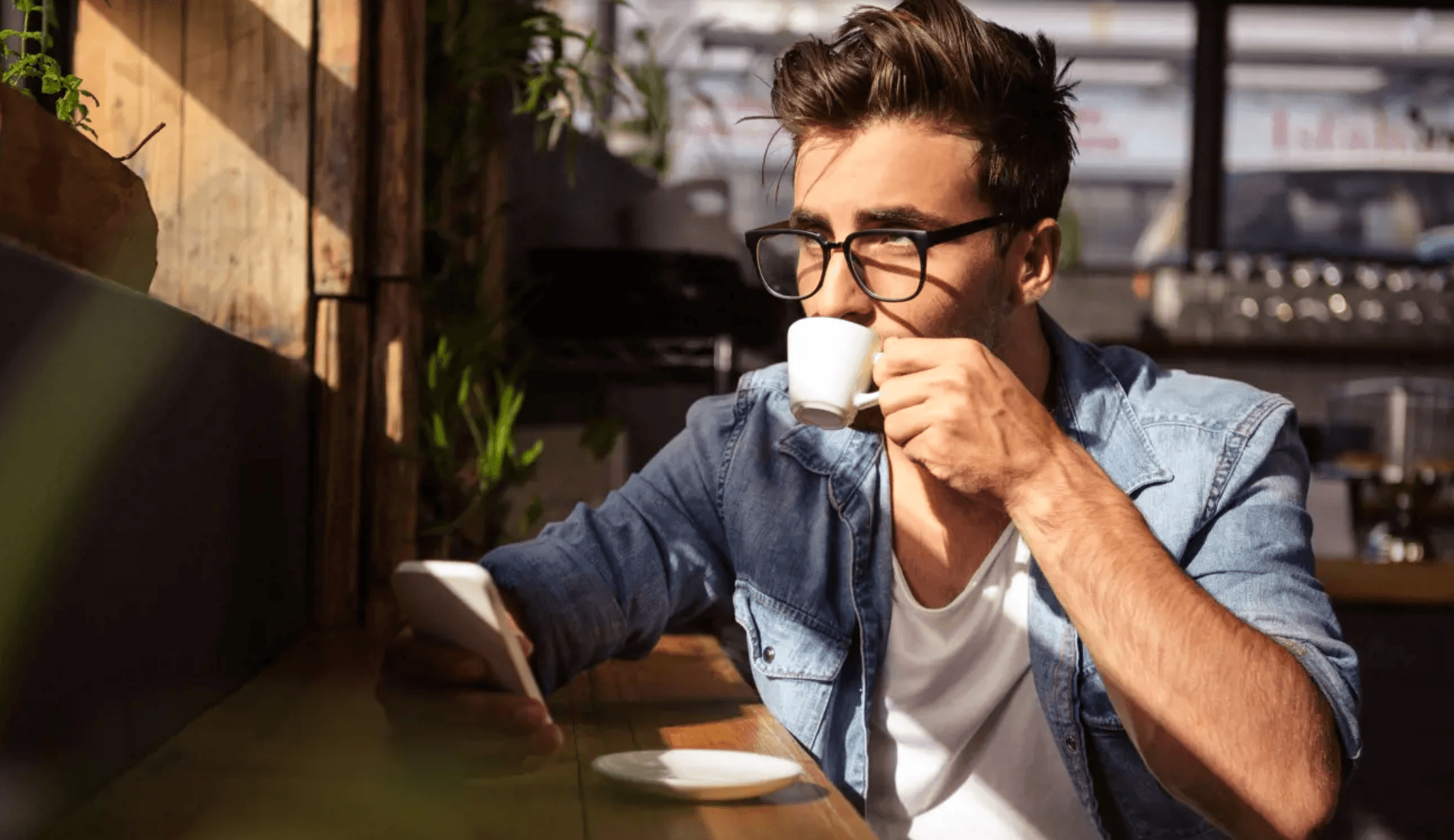 Why Lion's Mane Mushroom Tinctures Should be a part of your Daily Supplement Routine.White man drinking a hot beverage in a sunny cafe