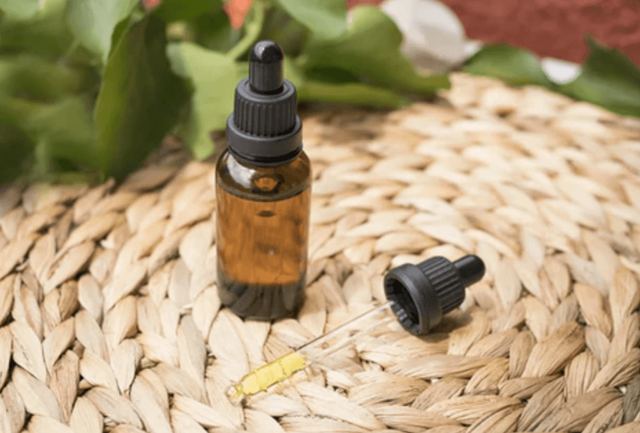 mushroom tinctures on a wood thread board 